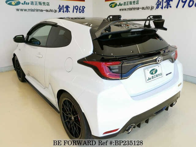 Toyota Yaris 2023 4WDGRMN GR backside white highlighting its rear wing and sporty features