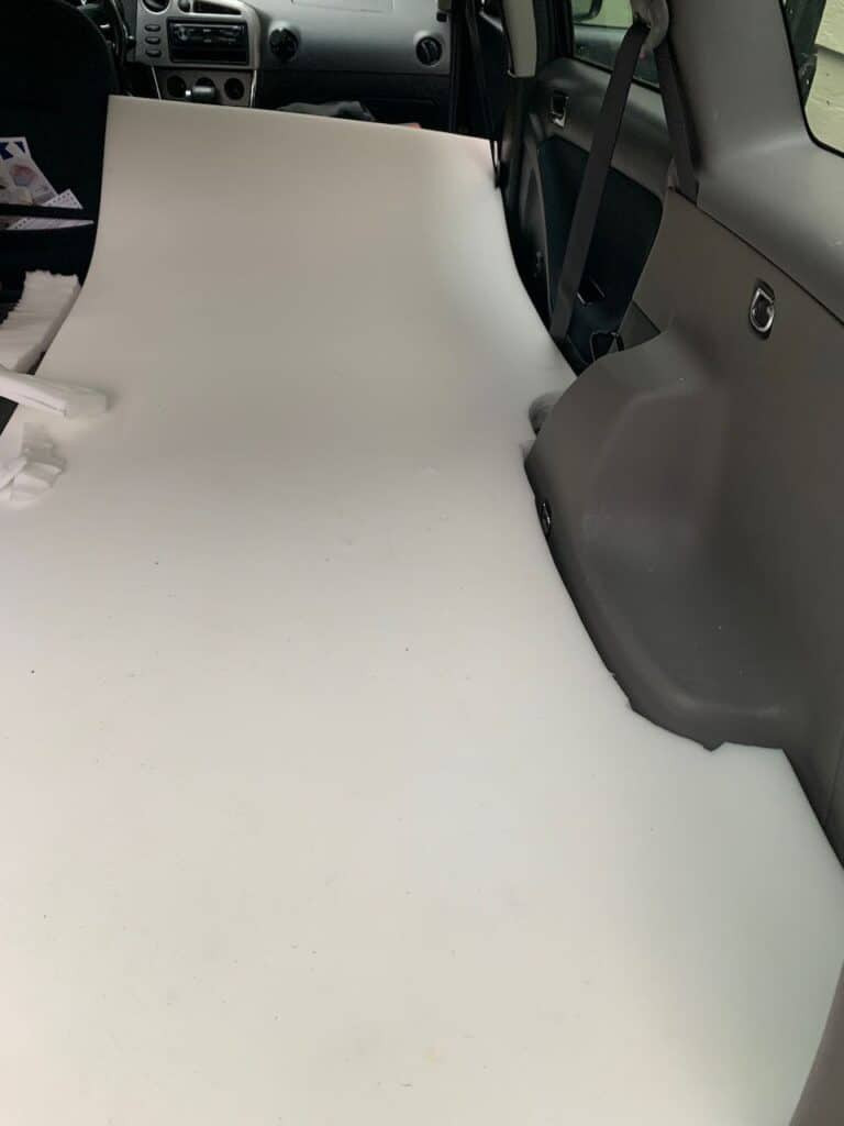 Cutting the foam for my mattress as I get ready to live in my Toyota Matrix