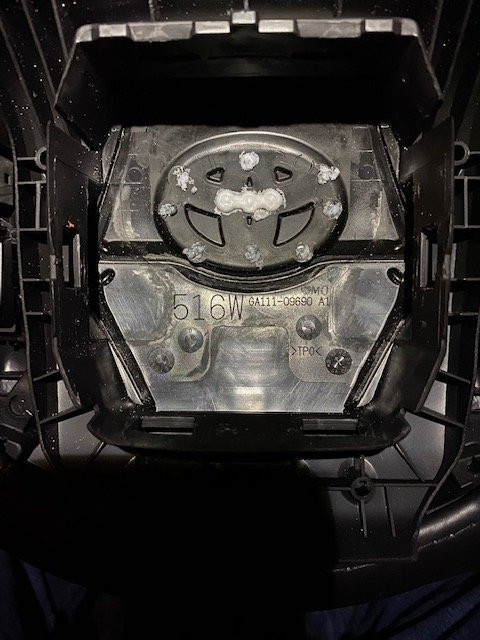 Close up of factory plastic welds securing the emblem