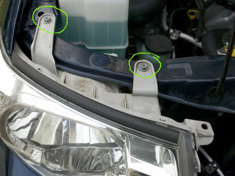 Toyota Tacoma headlight assembly with screws highlighted