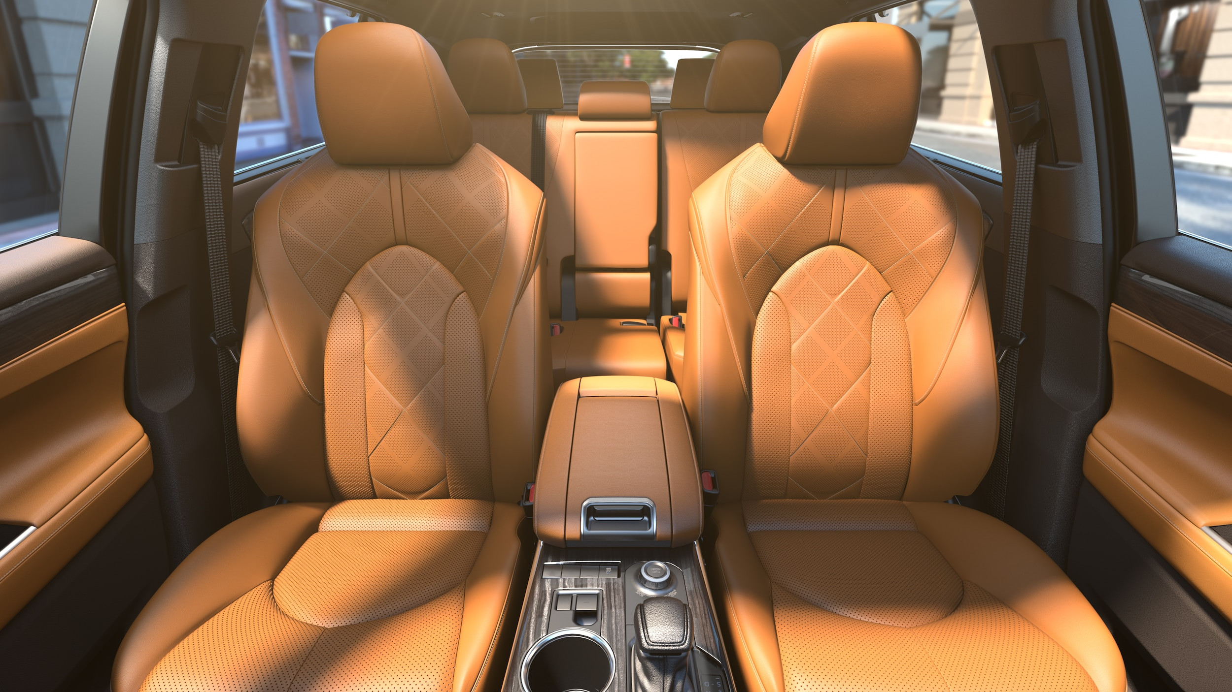 Luxurious car interior with tan leather seats featuring diamond stitching. Sunlight casts warm shadows, highlighting the modern and elegant design.