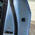 Access hole in side of Toyota Camry door