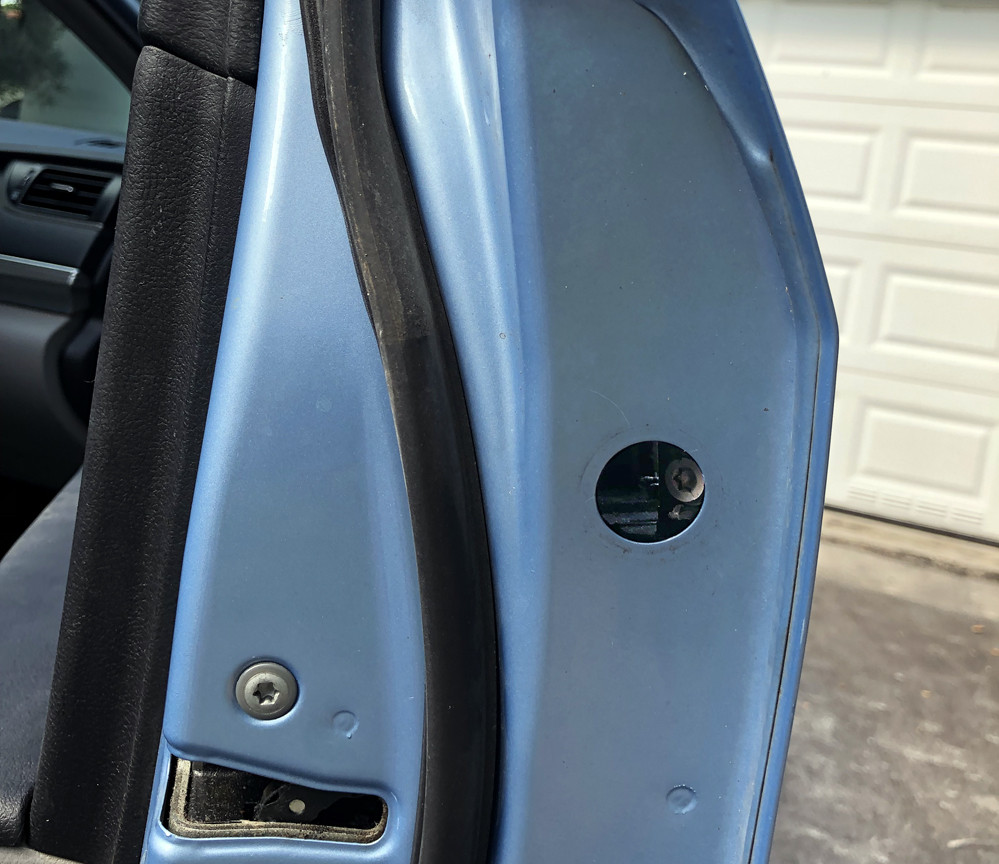 Access hole in side of Toyota Camry door
