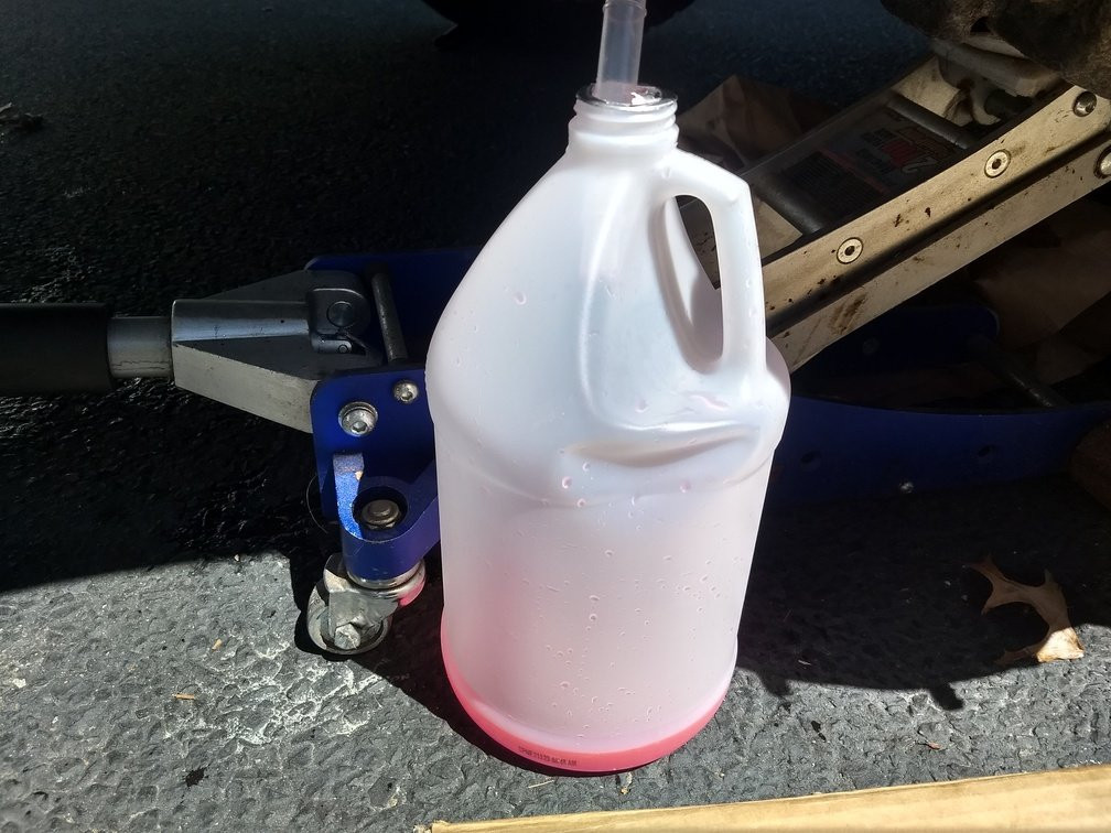 Draining the driver side engine block of a Toyota Tundra during coolant change