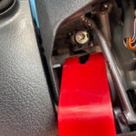 Removing left steering wheel cap to access airbag screws