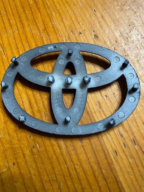 Close up of painted emblem pegs