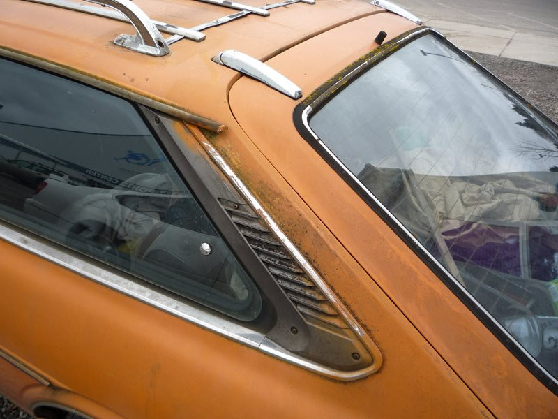 Side profile of a Toyota Corolla in a parking lot