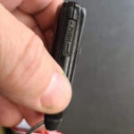 Removing the Prius emergency key in case the battery goes dead.