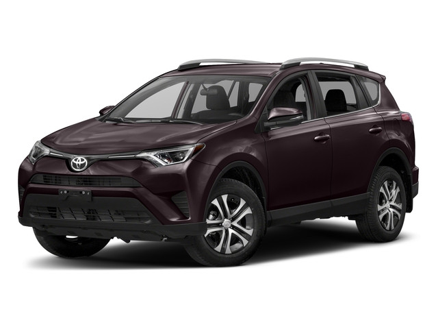 Toyota Rav4 SUV on a sunny day with clear blue sky and lush green trees in the background, showcasing its modern design and suitability for outdoor adventures.