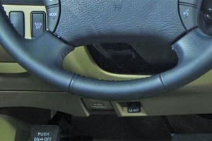 Toyota Tacoma SET button for TPMS reset, used when rotating tires to account for different inflation pressures between front and rear.