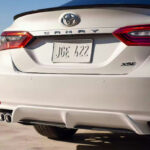 The back of a Toyota Camry XSE against a desert landscape