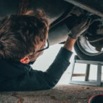 Man working on Toyota Corolla Engine