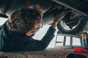 Man working on Toyota Corolla Engine