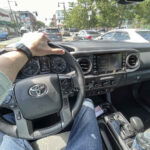 driving a Toyota Tacoma in the city